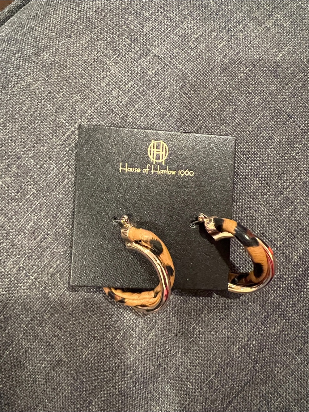 Gold and leopard twisted hoop earrings